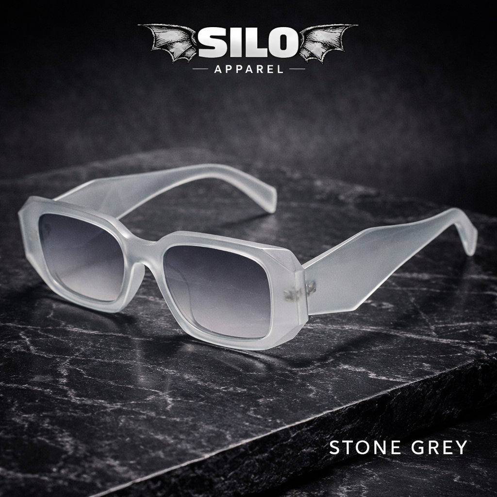 Stone grey sunglasses on a dark marble surface with 'Silo Apparel' branding.